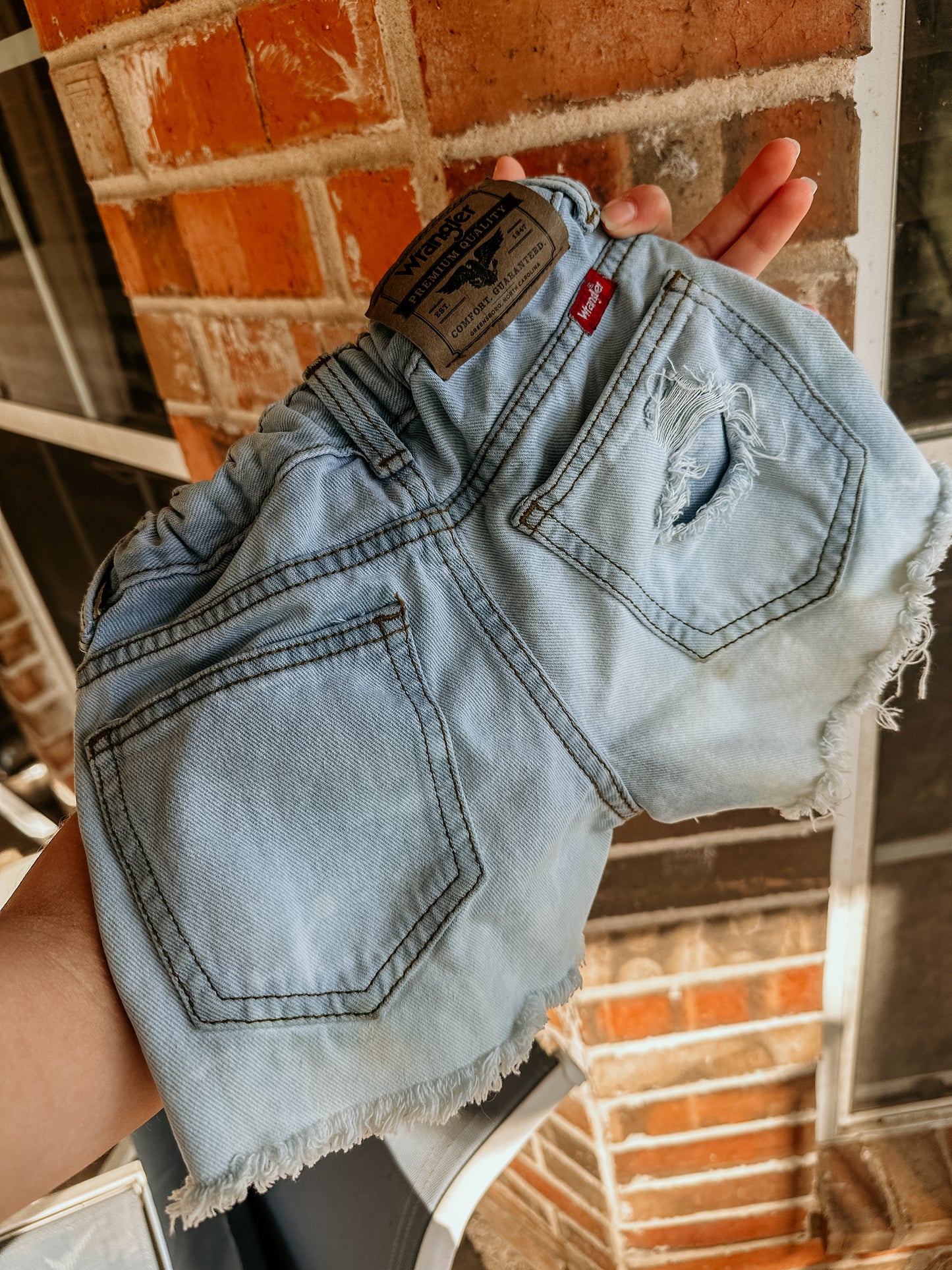 Distressed Wranglers size 4