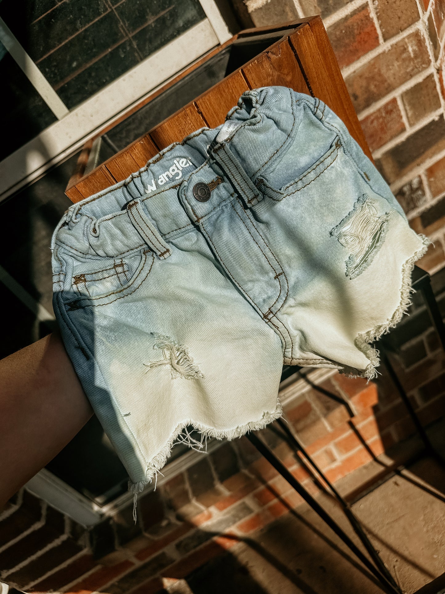 Distressed Wranglers size 4