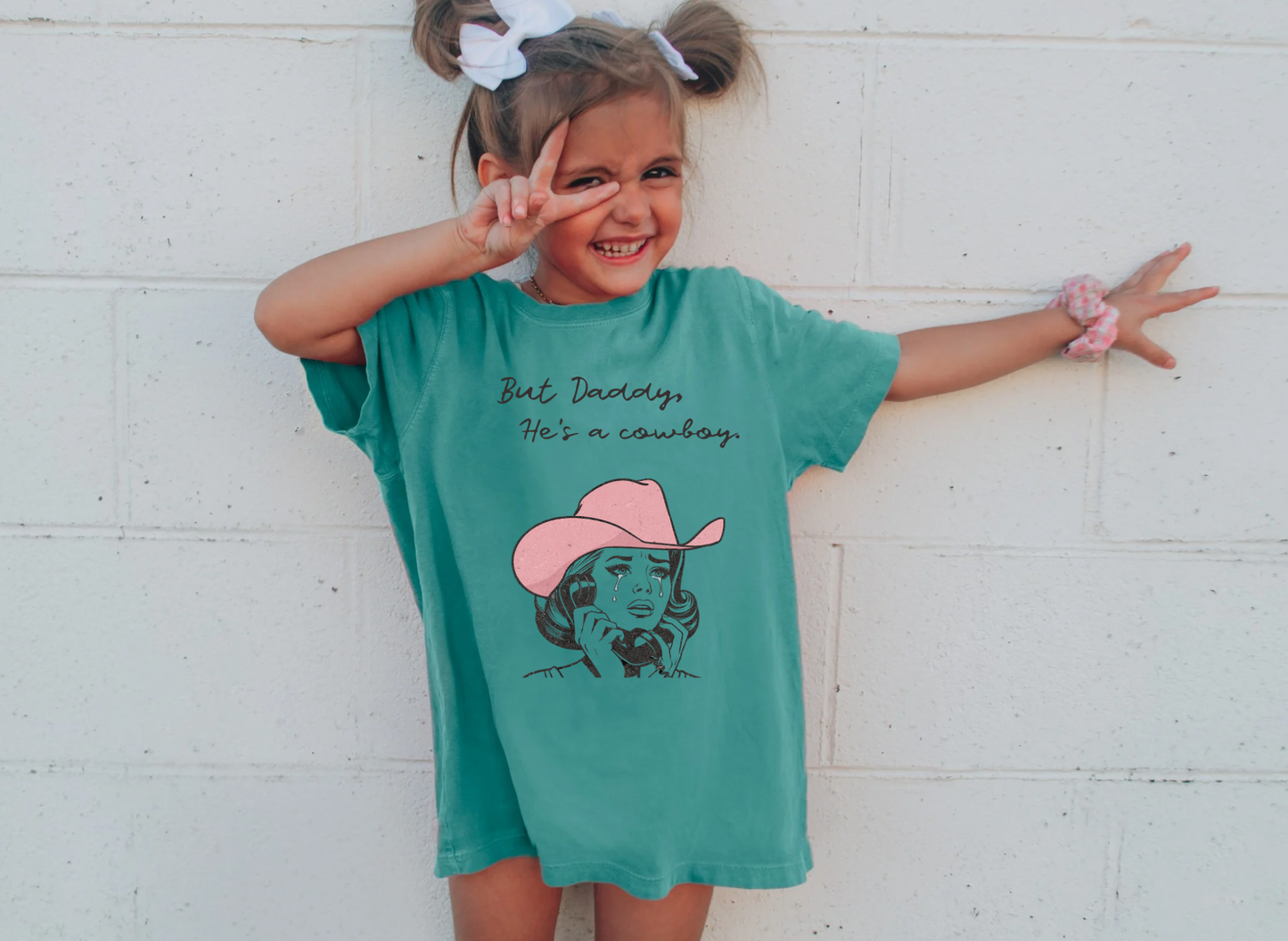 He’s a cowboy tee Youth